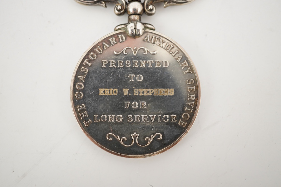 A cased ERII The Coastguard Auxiliary Service Long Service medal, awarded to Eric W. Stephens. Condition - good.